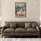 St. Anton - Alpine - Poster displayed above a cozy brown sofa in a modern living room, showcasing skiers in a snowy village.