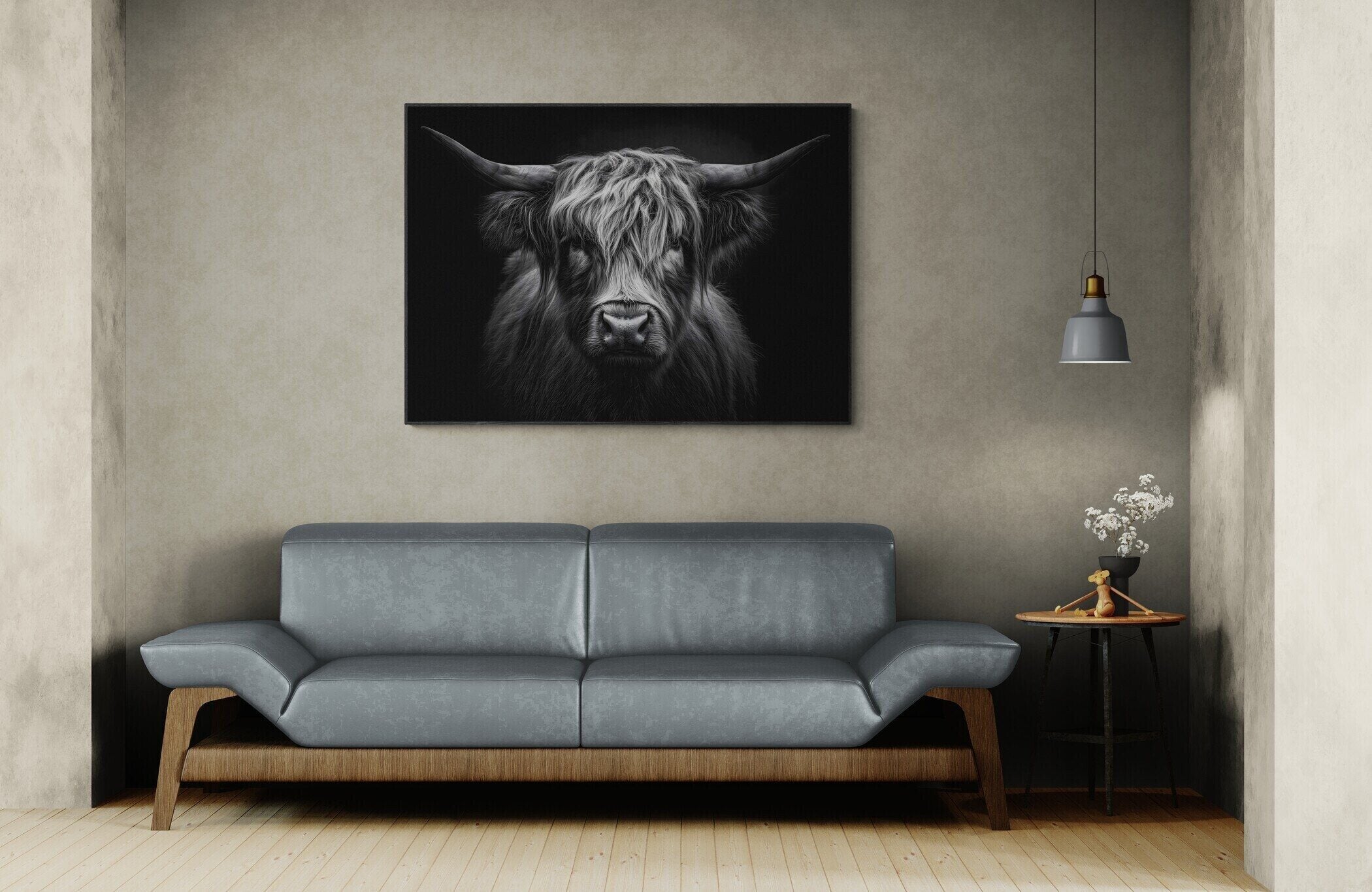 Strength of a highland cow - Alu-Dibond wall art displayed above a modern sofa in a stylish interior.