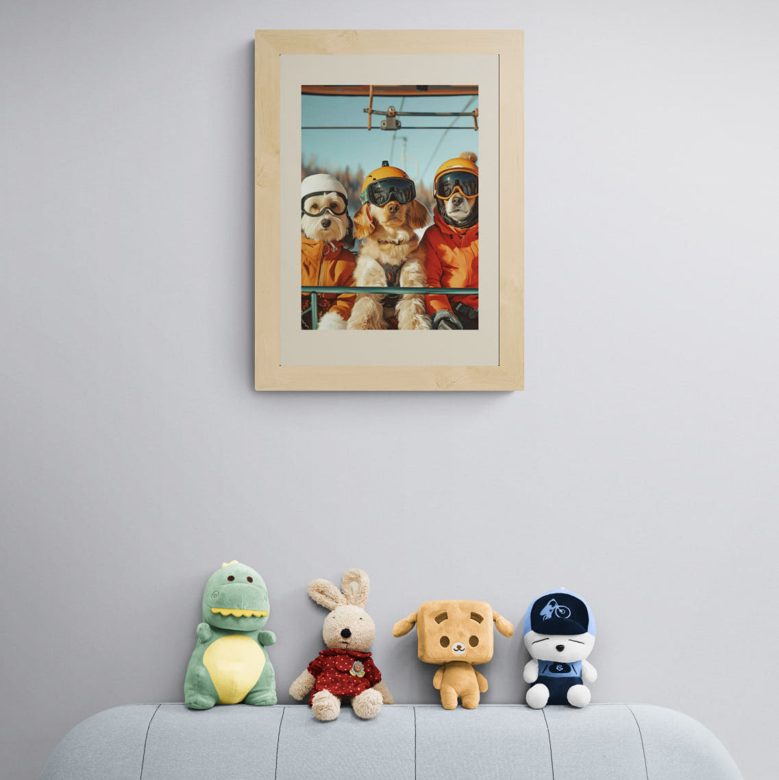 Three dogs of a skier - Poster displayed on a wall above colorful plush toys, creating a cheerful atmosphere.