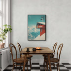 Verbier - Gondola View - Poster hanging in a dining room, showcasing a red gondola against snowy mountain backdrop.