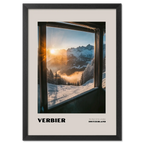Verbier - The Heart of the 4 Vallées - Poster showcasing sunrise over snowy mountains seen from a mountain lift window.