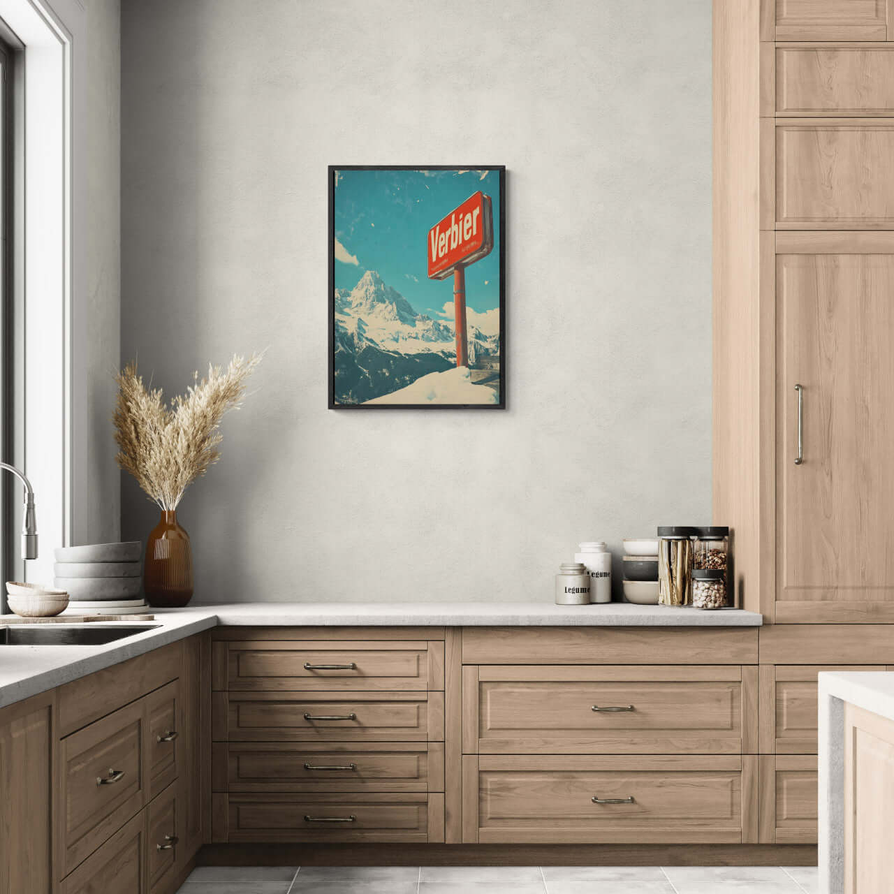 Verbier - Mountain Escape - Poster displayed in a modern kitchen, showcasing alpine scenery and a classic sign.
