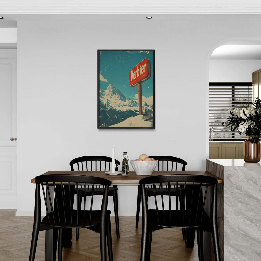 Verbier - Mountain Escape - Poster displayed in a modern dining area, featuring a classic red Verbier sign and alpine scenery.