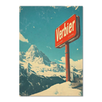 Verbier - Mountain Escape - Poster featuring a red Verbier sign against a snowy alpine landscape under a blue sky.