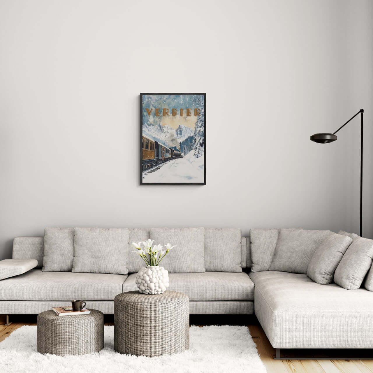 Verbier Skiing - Poster displayed in a modern living room, showcasing snowy mountains and a cozy atmosphere.
