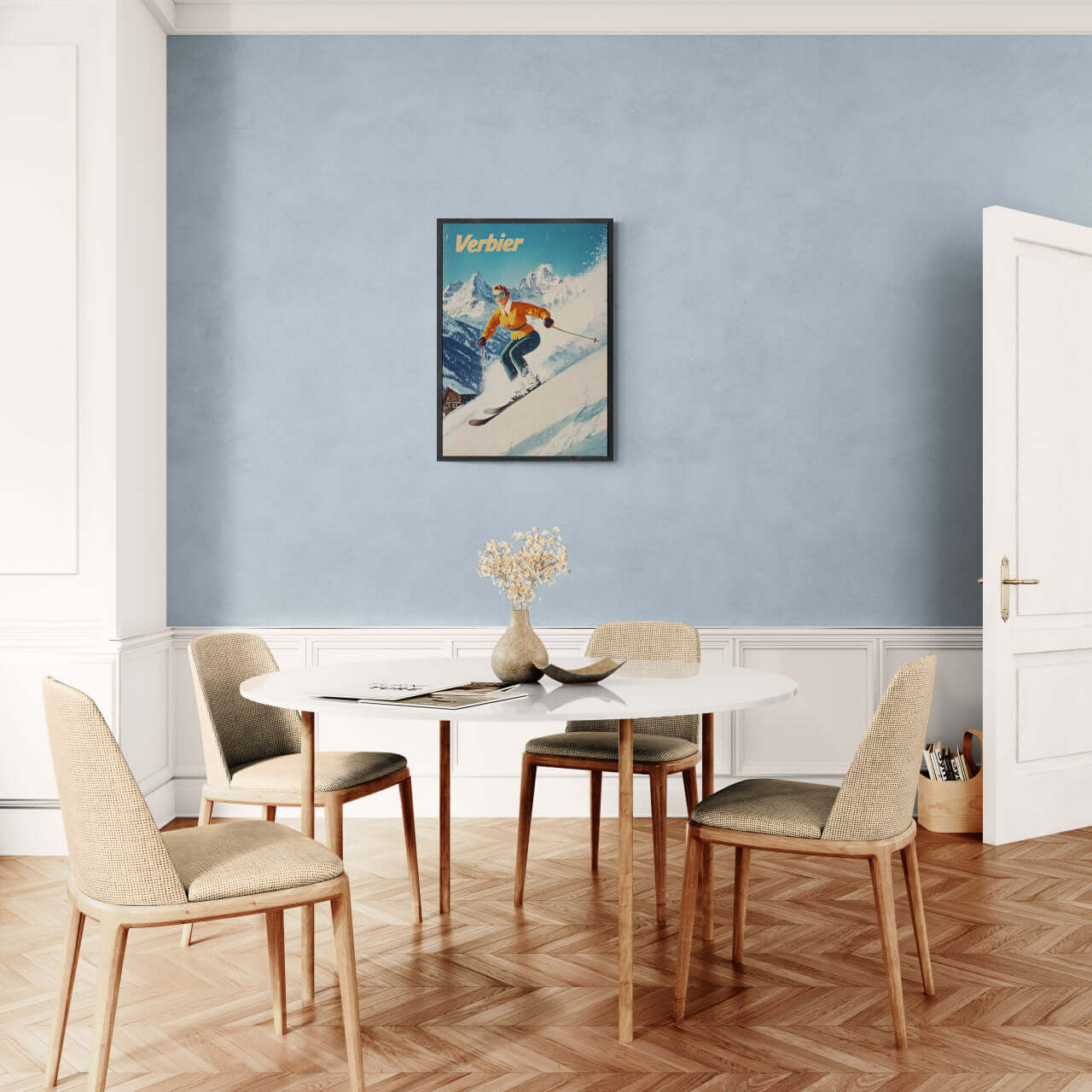 Verbier - Stylish Skier - Poster displayed in a modern dining room with a blue wall and elegant furniture.