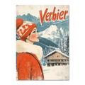 Verbier - Winter Elegance - Poster features a woman in red coat gazing at snowy mountains with a cozy chalet.