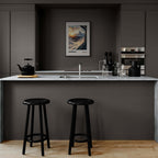 Zermatt - The Matterhorn - Poster displayed in a modern kitchen with black stools and sleek grey cabinetry.