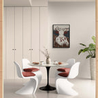 Zermatt’s Mountain Muse - Poster displayed in a modern dining area with stylish chairs and table.